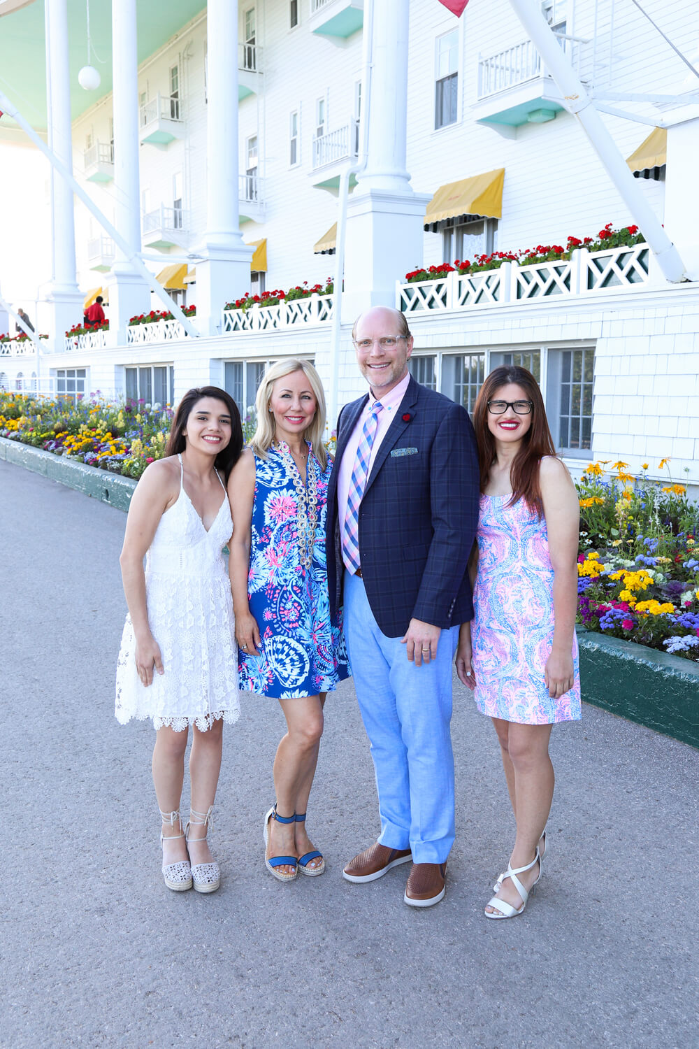 Dr. Schindler smiling with her awards by her side.